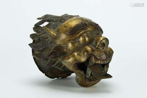 An early gilt bronze dragon head specimen