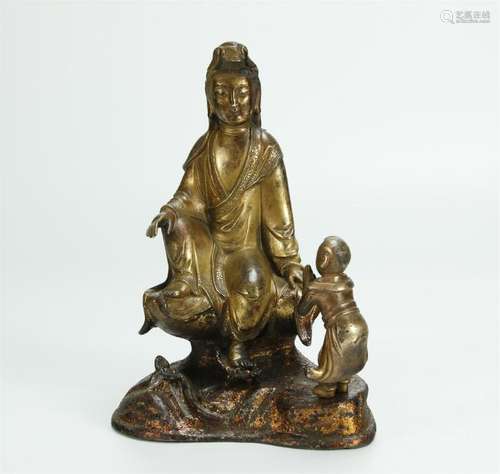 Superb gilt bronze figure of Guanying/boy