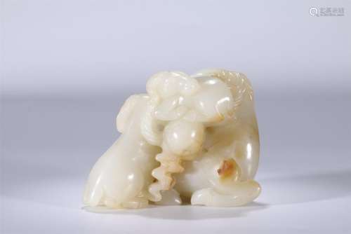 A well-carved white jade three rams group specimen