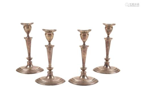 SET OF FOUR MATCHED VICTORIAN SILVER CANDLESTICKS