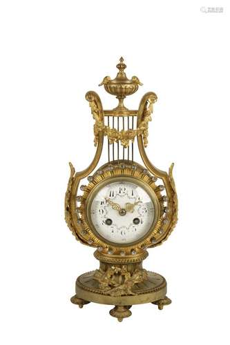 A BELLE EPOQUE LYRE-SHAPED GILT METAL MANTEL CLOCK