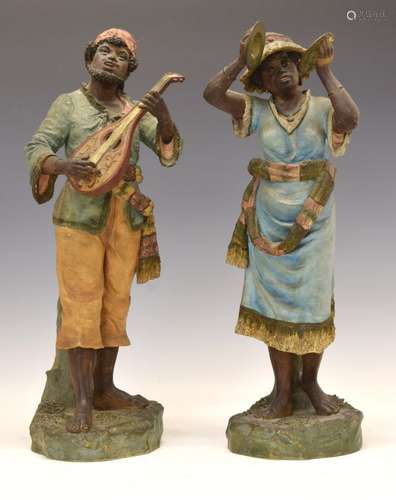 Pair of late 19th Century Continental terracotta figures, probably Austrian, each depicting street