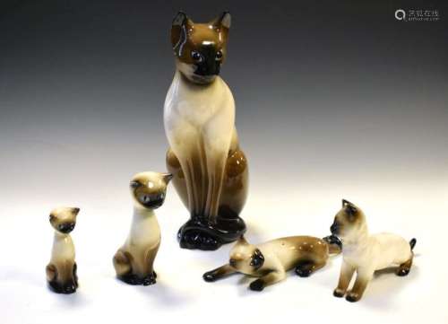 Group of five 20th Century pottery Siamese cats, the largest with impressed number 316 to base and