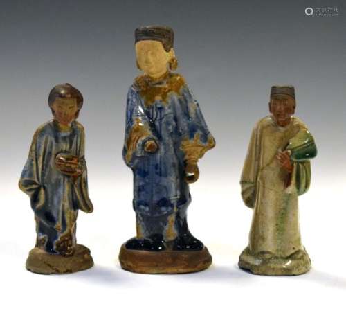 Three Oriental glazed pottery figures, the tallest 16.5cm high