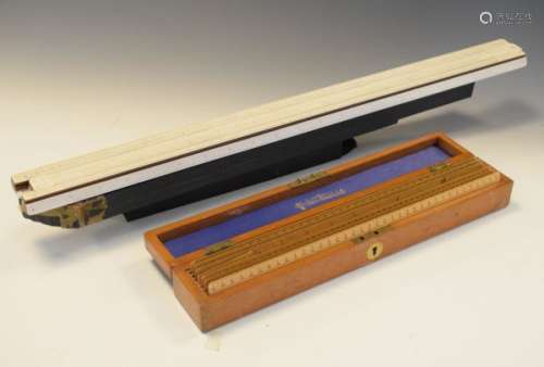 Cased set of seven early 20th Century boxwood rulers by Stanley, London, together with an ivorine