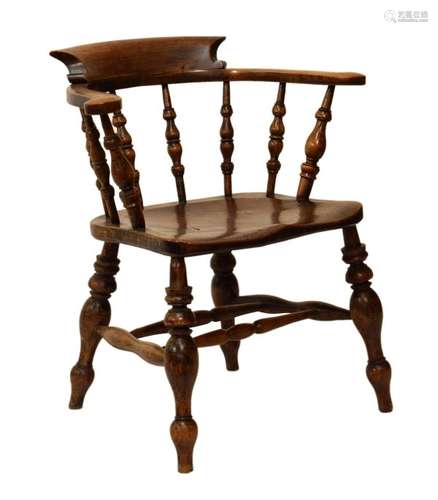 Late 19th Century elm and fruitwood 'smokers bow' armchair with saddle seat on turned supports