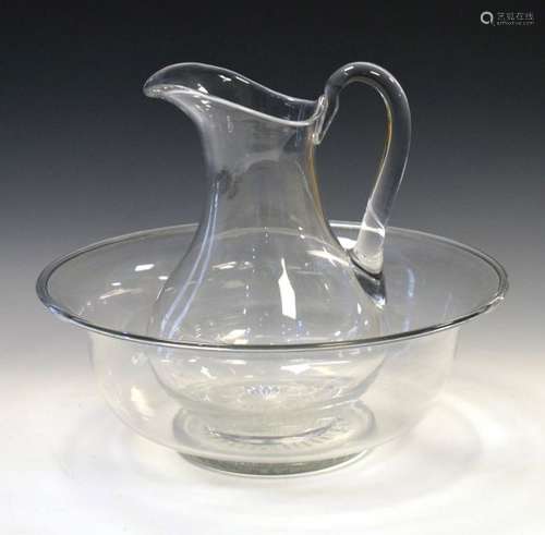 Glass jug and bowl, the jug 30cm high, the bowl measuring 38.5cm diameter