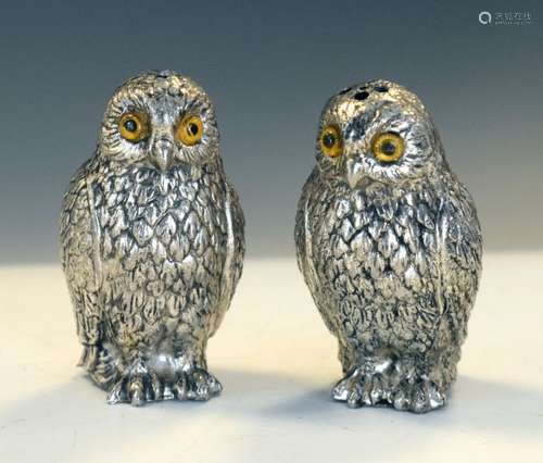 Pair of cast base metal novelty Owl pepperettes, each with yellow glass eyes, 7.5cm high (2)