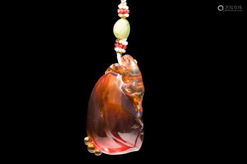 AMBER CARVED 'MYTHICAL BEAST' PENDANT