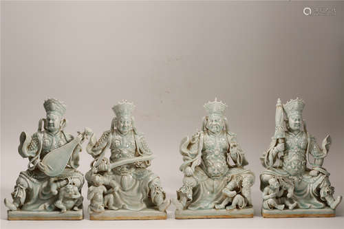 A Set of Four Chinese Celadon Porcelain Figures of Buddha