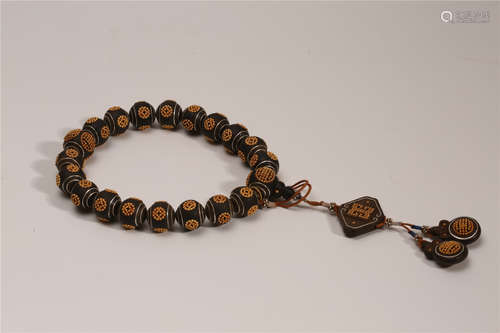 A Chinese Carved Agar-Wood Bracelet