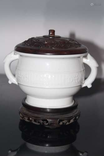 A Chinese White Glazed Porcelain Incense Burner with Carved Rosewood Cover and Stand