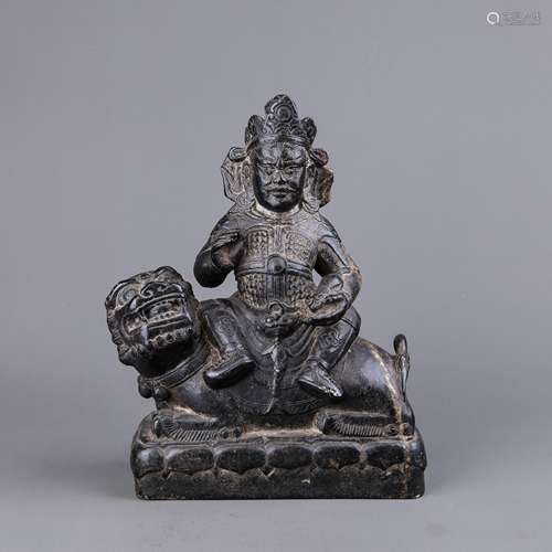 A Chinese Carved Black Stone Buddha