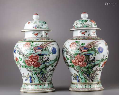 A Chinese pair of famille verte vases with cover