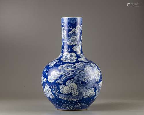 A Chinese blue and white 'dragon' bottle vase