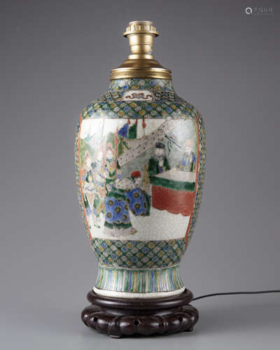 A Chinese famille verte vase moudeled as a lamp