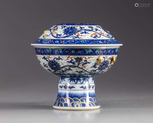 A Chinese blue and white stem bowl with cover