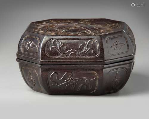 A Chinese carved hardwood ‘Eight Immortals’ octagonal box and cover