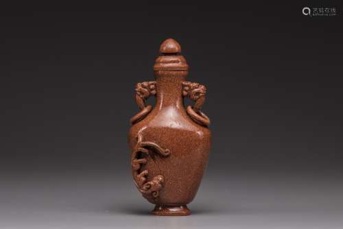 A Chinese goldstone baluster vase and cover