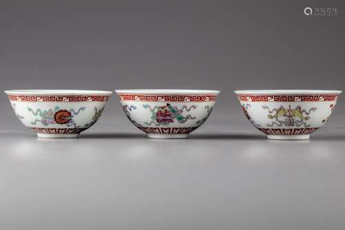 Three Chinese famille rose bowls with two spoons