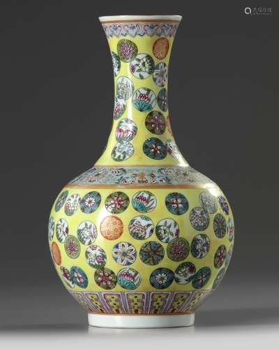 A Chinese yellow ground famille rose 'flower roundel' vase