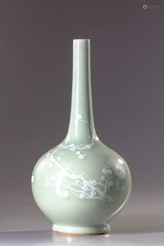 A Chinese slip decorated celadon porcelain vase