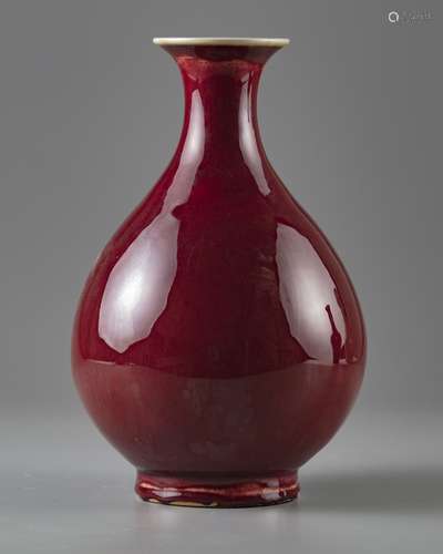 A Chinese red glazed pear shaped vase 'Yuhuchunping'