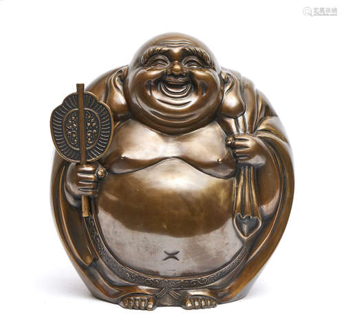 Heavy brass figure of a laughing Hotei with a protruding belly