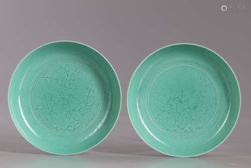 A Chinese pair of green glazed dishes
