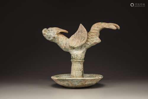 A Chinese green-glazed dragon-carp oil lamp