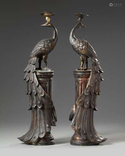 A pair of Chinese bronze 'peacock' candle sticks