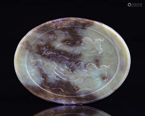 A Chinese oval shaped jade plaque