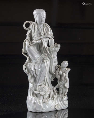 A Chinese dehua glazed figure of Guanyin and a boy