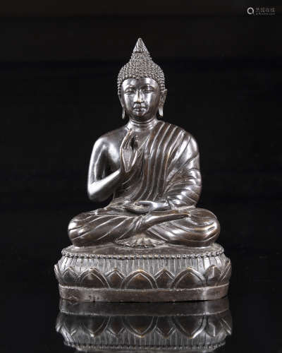 A Nepalese bronze seated figure