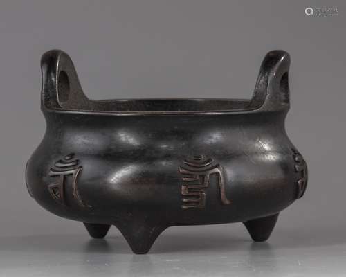 A Chinese bronze tripod censer