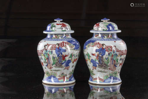 A pair of Chinese wucai glazed pots and covers