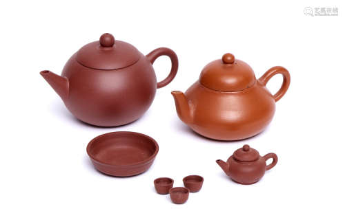 A collection of three Chinese brown Yixing-style mini-teapots