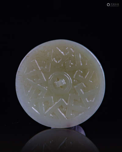 A Chinese jade carving of a scholar mirror