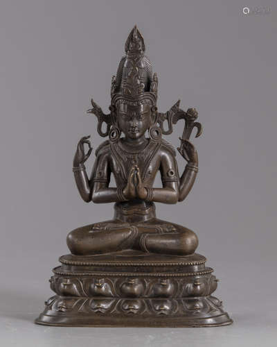 A Sino-Tibetan four armed bronze figure