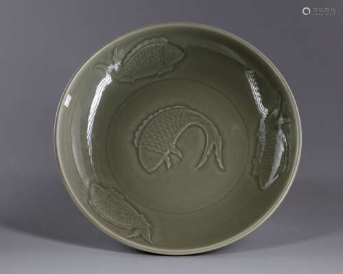 A Chinese celadon glazed ‘carps’ charger