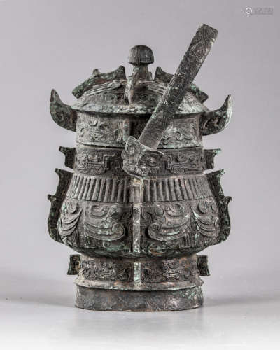 A Chinese bronze ritual wine vessel and cover