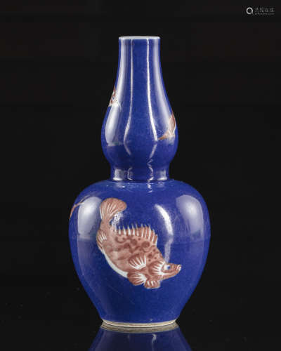 A Chinese blue ground double-gourd vase