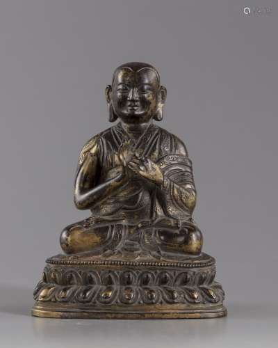 A Chinese gilt bronze figure of a Lama