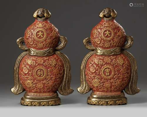 A pair of Chinese imitation lacquer double gourd wall vases
