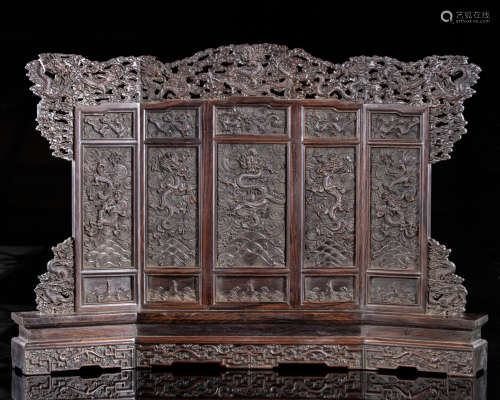 A Chinese hardwood carved ‘dragons’ table screen