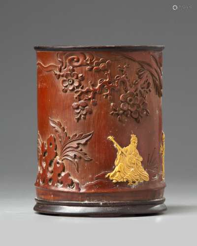 A Chinese wooden brush pot