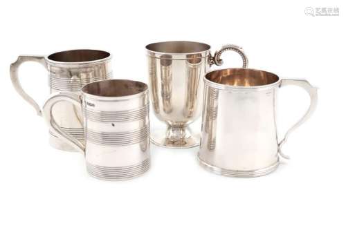 A small collection of four silver mugs, comprising…
