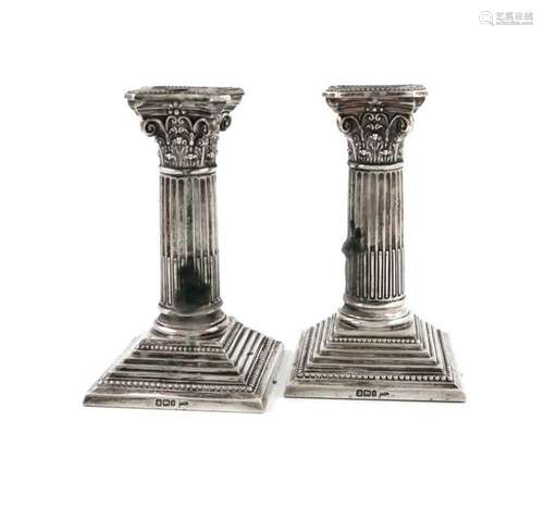 A pair of late Victorian silver dwarf candlesticks…