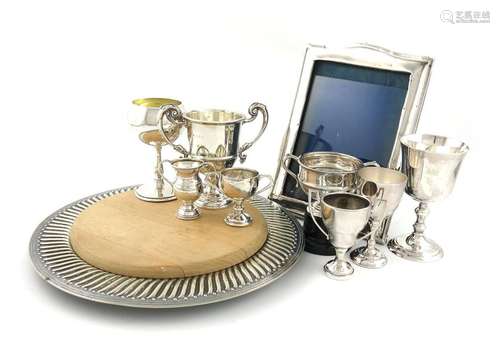 A mixed lot, comprising silver items: a photograph…