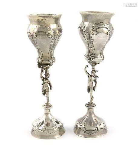 A pair of late 19th century silver vases, with imp…